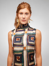 ALBANA New York Barcelona sleeveless mock neck blouse with a sophisticated abstract plaid pattern in navy, cream, brown, and green. Silky polyester.