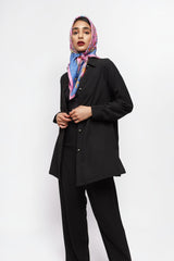ALBANA New York black textured crepe button-down shirt with antique silver buttons worn by a model in a headscarf.