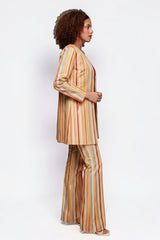 ALBANA New York Carousel Stripe Jacket in multi-colour vertical stripes worn by a model with matching flare pants