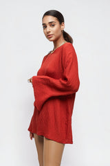 ALBANA New York coral red textured linen tunic with a high neck and wide sleeves worn by a model