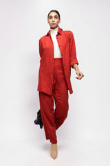 ALBANA New York coral red textured linen button-down shirt worn by a model with matching wide-leg pants.