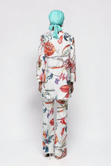 ALBANA New York cotton flare pants with vibrant fruit and floral print, worn with matching blazer and teal headwrap