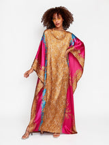 ALBANA New York fuchsia and gold satin kaftan with wide sleeves and mixed motif print worn by a model