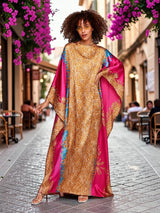 ALBANA New York fuchsia and gold satin kaftan with wide sleeves and mixed motif print worn by a model
