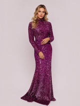 ALBANA New York fuschia ombre sequin mermaid evening gown with long sleeves and mock neck on a blonde model