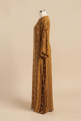 ALBANA New York Gilded Amber silk kaftan with tonal geometric patterns, wide sleeves, and a flowing floor-length fit.