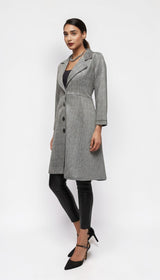 ALBANA New York grey plaid longline blazer coat with lapel collar and button front worn by a model