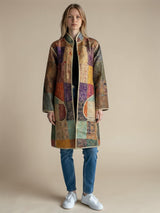 Model wearing ALBANA New York Imperial Mosaic Silk Jacket with noir trim, curved patch pockets, and open front design.
