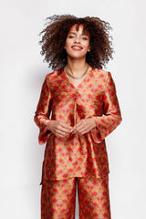 ALBANA New York Mandarin Scrolls silk tunic with vibrant red and orange floral print on a model