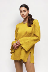 ALBANA New York saffron yellow textured linen tunic with high neck and wide sleeves worn by a model.