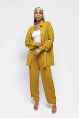 ALBANA New York saffron textured linen button-down shirt and matching wide-leg pants worn by a model with a headscarf.