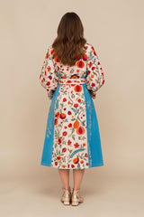 ALBANA New York velvet duster coat with cream base, blue side panels, and vibrant silk Uzbek floral embroidery.