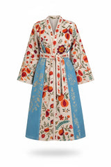 ALBANA New York velvet duster coat with cream base, blue panels, and vibrant silk Uzbek floral embroidery and belt.