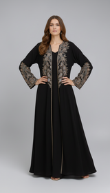 ALBANA New York black embroidered abaya with integrated dress, featuring intricate gold and blue detailing on the neckline and sleeves.