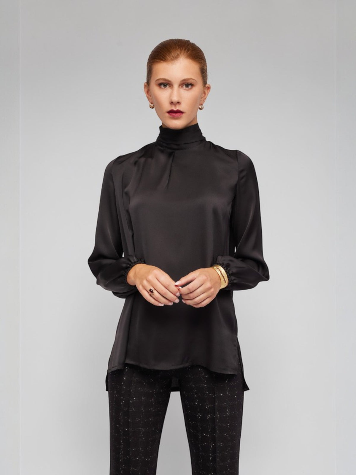 ALBANA New York black silky polyester long sleeve blouse with mock neck, front pleats, elastic cuffs, and back zipper.
