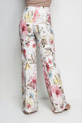 ALBANA New York blush floral print cotton flare pants with a mid-rise tailored silhouette, back view.