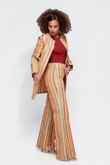 ALBANA New York Carousel Stripe Pants in fluid polyester with multi-directional stripes and a sweeping flare cut.