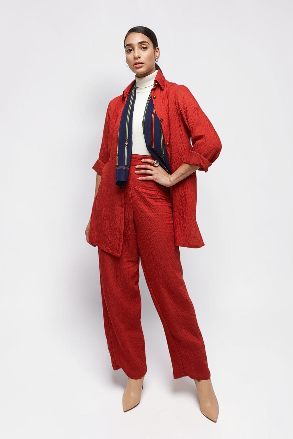 ALBANA New York coral red textured linen button-down shirt worn with matching wide-leg pants and a silk scarf