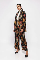 ALBANA New York wide leg pants and matching blazer in black crepe with orange and yellow fall foliage print.