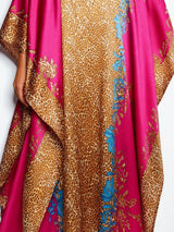 ALBANA New York fuchsia satin kaftan with gold leopard print and vibrant turquoise floral accents in a flowing silhouette