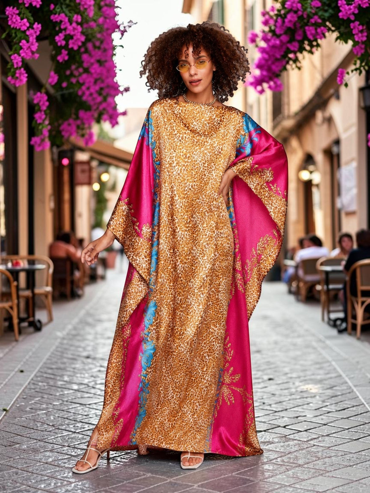 ALBANA New York fuchsia and gold satin kaftan with wide sleeves and mixed motif print worn by a model