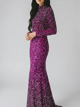 ALBANA New York fuschia ombre sequin mermaid evening gown with long sleeves and mock neck on a model