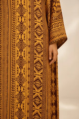 ALBANA New York Gilded Amber silk kaftan featuring intricate tonal geometric patterns and wide sleeves.