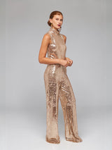ALBANA New York gold sequin sleeveless mock neck blouse and matching wide-leg trousers worn by a model.
