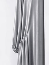 ALBANA New York gray satin duster abaya featuring gathered side pockets and long sleeves with elastic cuffs.
