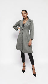 ALBANA New York grey plaid longline blazer coat worn by a model with black trousers and heels against a white backdrop
