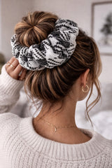ALBANA New York oversized black and white houndstooth knit scrunchie worn in a messy bun hairstyle