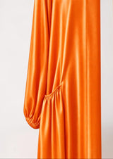 ALBANA New York orange satin abaya featuring gathered side pockets and long sleeves in a smooth, lustrous fabric.