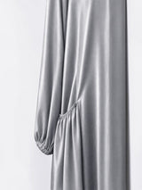 ALBANA New York satin maxi duster abaya in orange with gathered side pockets and long sleeves.