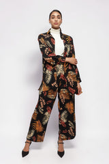ALBANA New York model wearing matching black crepe foliage print wide leg pants and button-down shirt