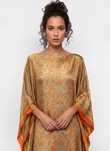 ALBANA New York silk kaftan maxi dress featuring a vibrant orange and green paisley print with wide kimono sleeves.