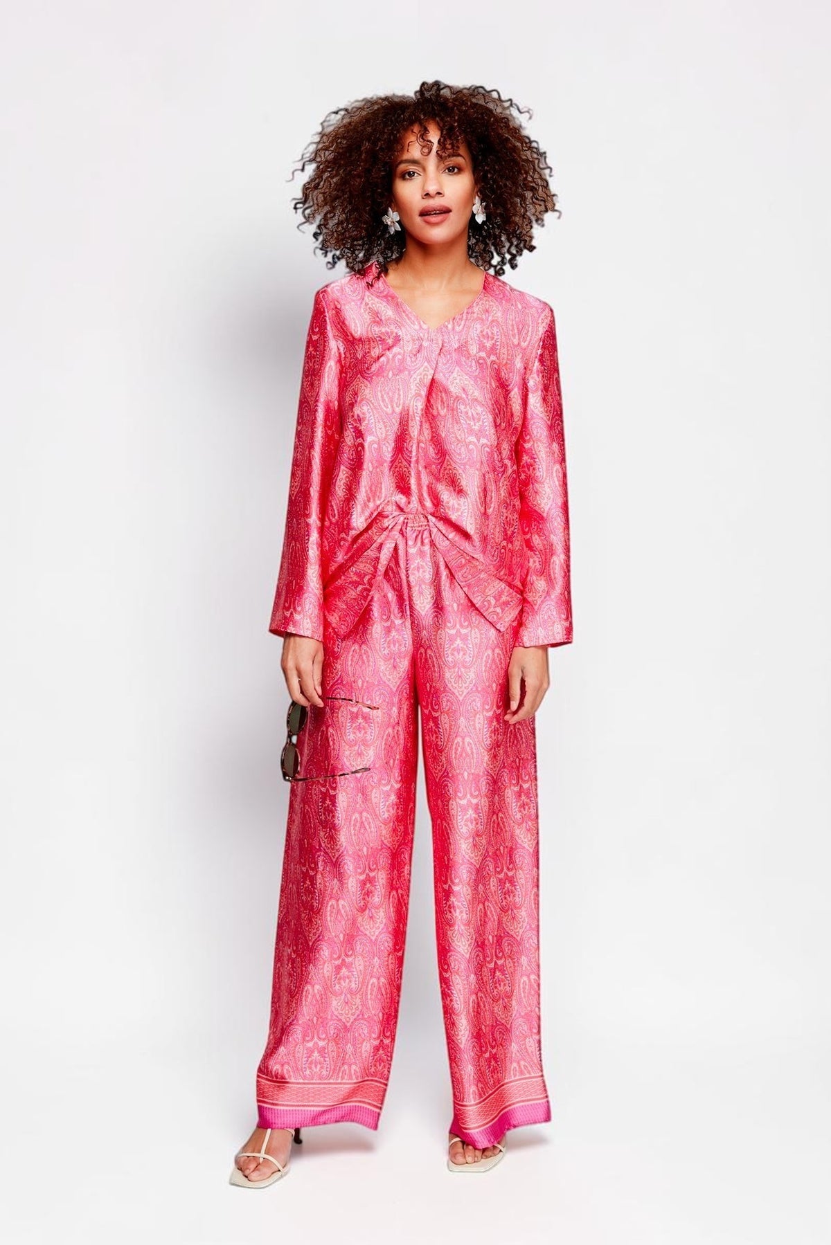 ALBANA New York rose pink silk tunic and matching wide-leg pants with ethnic print worn by a model in a studio.