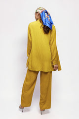 ALBANA New York saffron textured linen wide leg pants and matching long sleeve top worn by a model with a headscarf.
