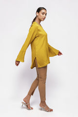 ALBANA New York saffron yellow textured linen tunic with high neck and wide sleeves worn by a model