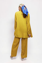 ALBANA New York saffron textured linen shirt and matching wide-leg trousers worn by a model with a silk headscarf