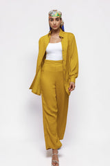 ALBANA New York saffron textured linen wide leg pants and matching button-down shirt worn by a model.