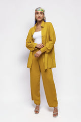 ALBANA New York saffron textured linen wide-leg pants and matching button-down shirt worn by a model.