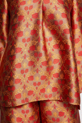 ALBANA New York silk tunic featuring a vibrant red and gold floral scroll pattern with a symmetrical panel design.