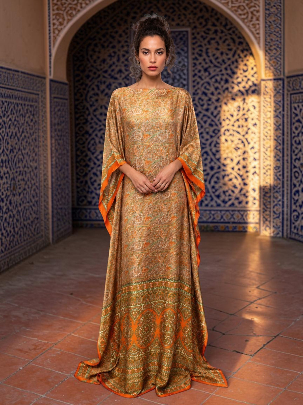 ALBANA New York silk kaftan maxi dress with orange and green paisley print, kimono sleeves, and floor-length silhouette.