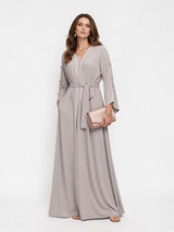 ALBANA New York Stone Veil maxi kaftan in stone grey with long sleeves, waist tie, and elegant fluid silhouette.