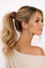 Model wearing an ALBANA New York mini tartan plaid scrunchie in a high blonde ponytail against a white background.