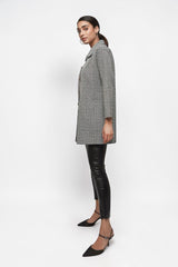 ALBANA New York textured button down collared jacket in black and white worn by a model with black leather leggings