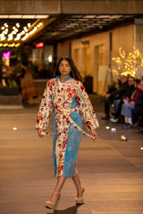 ALBANA New York velvet duster coat with colorful silk Uzbek embroidery, kimono style, worn by a model on a runway.