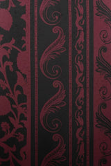 Close-up of ALBANA New York silk kaftan fabric featuring a rich wine and black tonal floral and scroll pattern.